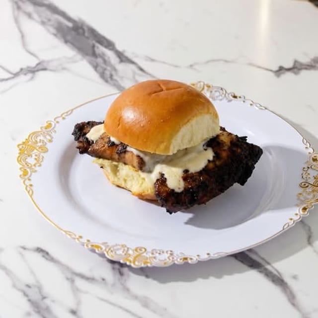 1 Jerk Chicken Slider with small side.